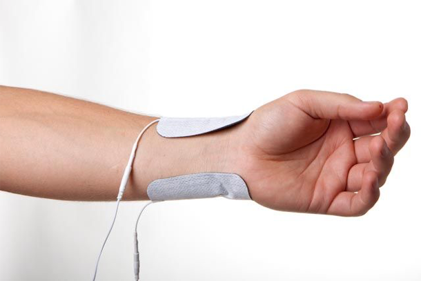 ASTYM image being used on a patient's arm